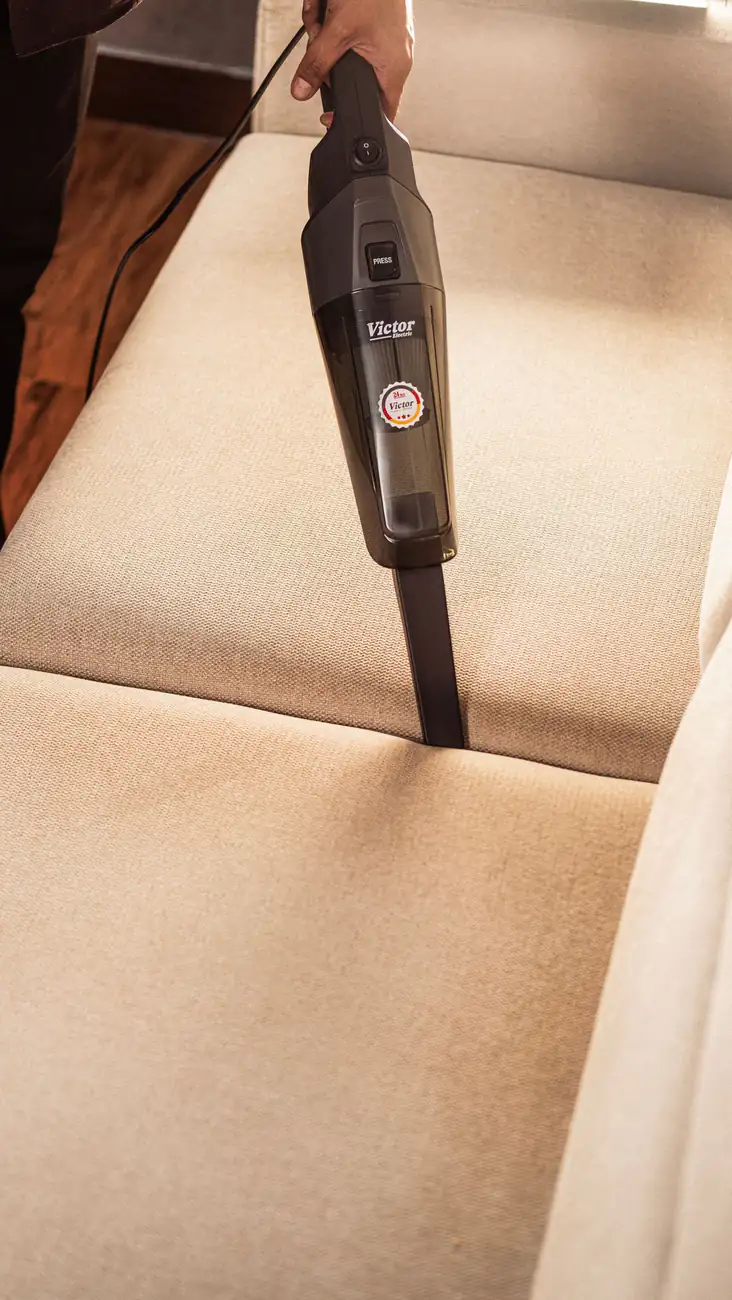 Sofa fabric cleaning | Carpet cleaning in Heaton Fabric sofa seat being cleaned with an upholstery extraction tool, carpet cleaning in Heaton