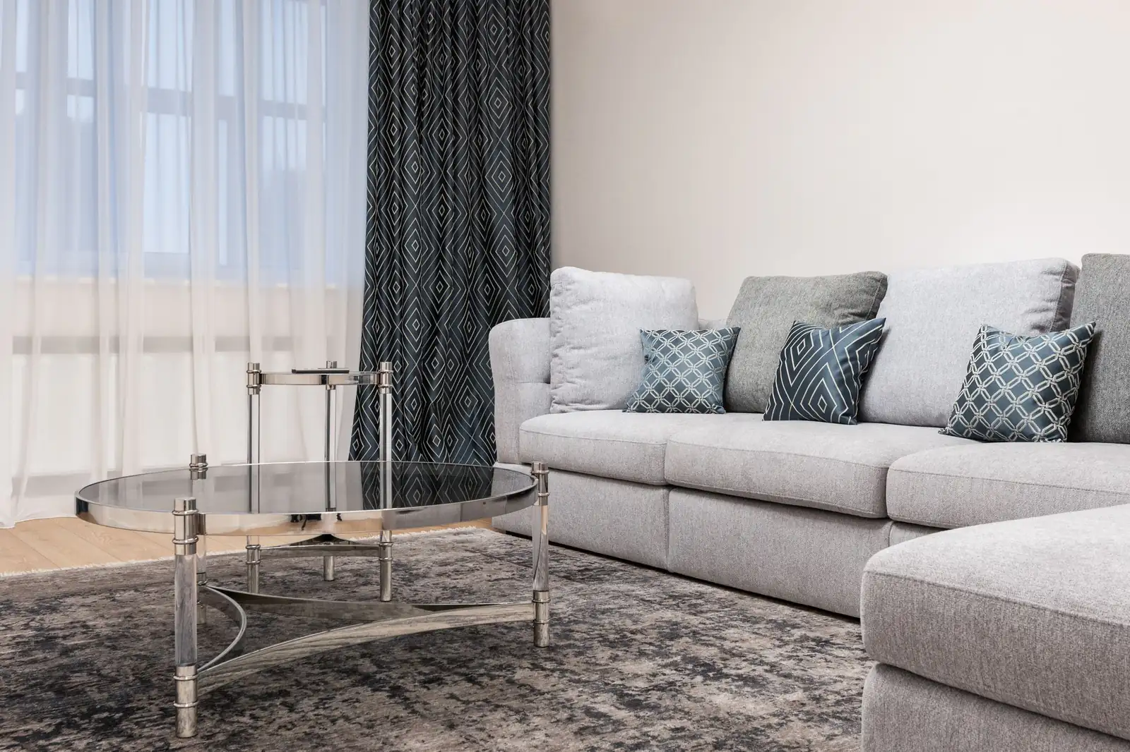 Clean living room carpet | Carpet cleaning in Newcastle Bright modern living room with a freshly cleaned grey carpet and light sofa, carpet cleaning in Newcastle