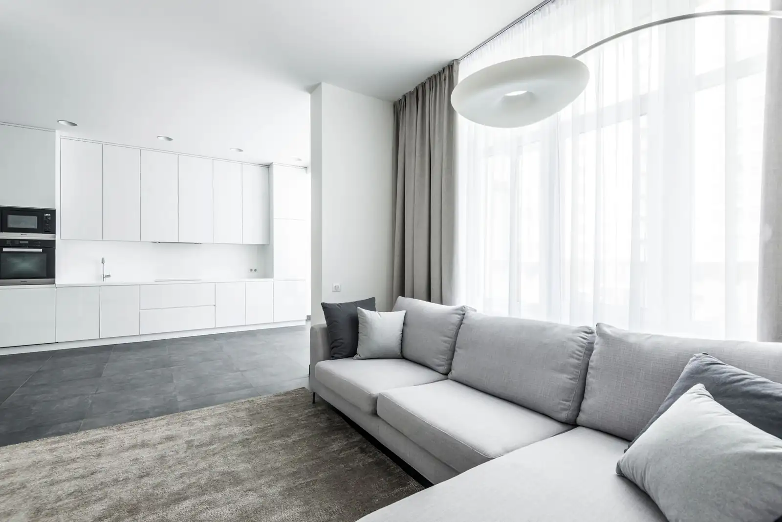 Open-plan living room | Free carpet cleaning quote in Newcastle Bright, modern open-plan living room with a light sofa, free carpet cleaning quote in Newcastle