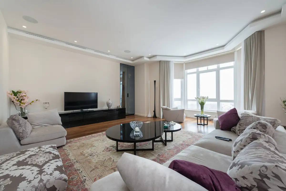 Spacious lounge with a large soft carpet and modern furniture, carpet stain removal in Newcastle