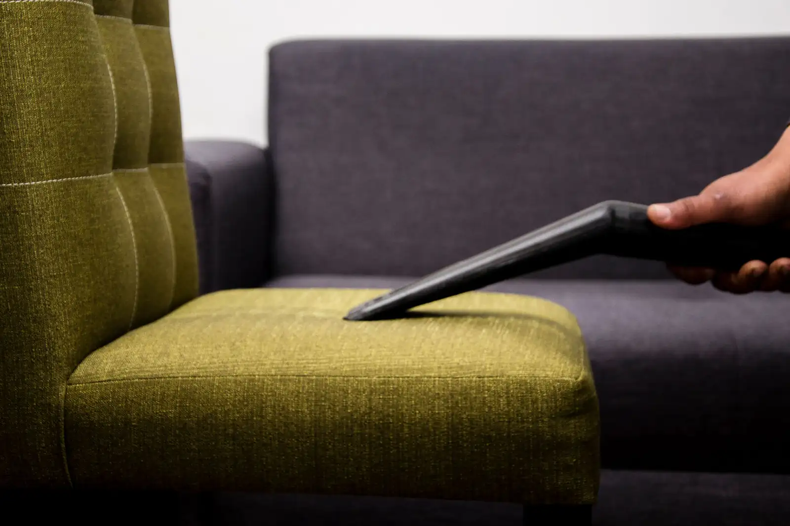 Armchair upholstery cleaning | Upholstery cleaning in Newcastle Fabric armchair being cleaned with a professional upholstery tool, upholstery cleaning in Newcastle